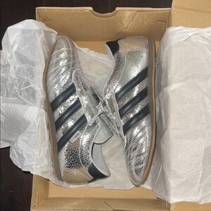 Gently Used Women’s Adidas Taekwondo Metallic Silver Sneakers with Black Stripes